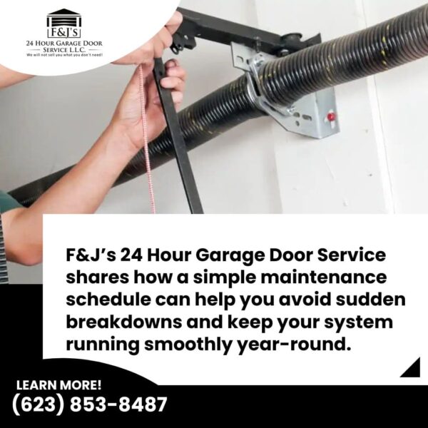 Technician adjusting garage door torsion spring during routine maintenance to prevent breakdowns